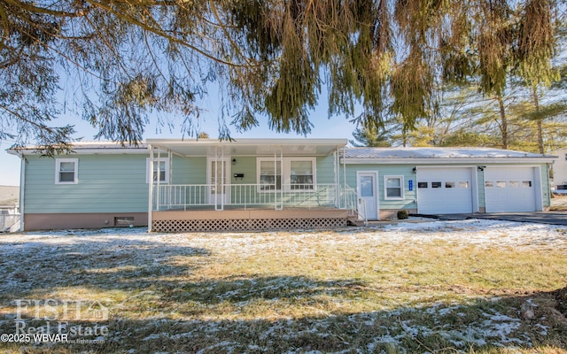 single story home featuring a garage, covered porch, and a front yard