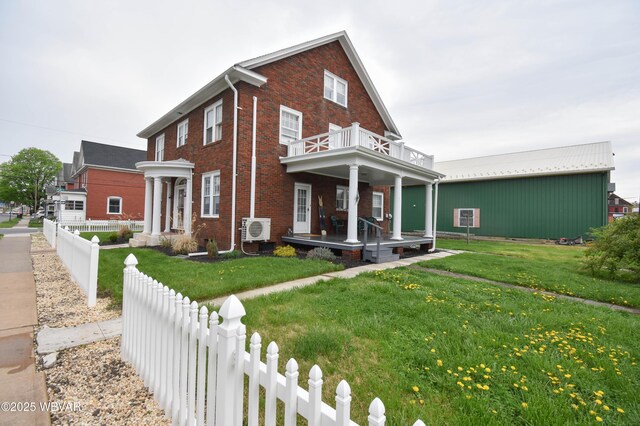 45 W Bald Eagle St, Lock Haven, PA 17745 - view of front facade with a balcony, a cooling unit, a porch, and brick siding