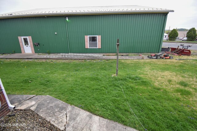 45 W Bald Eagle St, Lock Haven, PA 17745 - rear view of property with a yard, metal roof, a pole building, and an outbuilding