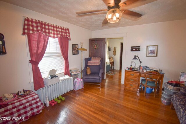 45 W Bald Eagle St, Lock Haven, PA 17745 - living area with radiator, hardwood / wood-style flooring, and a ceiling fan