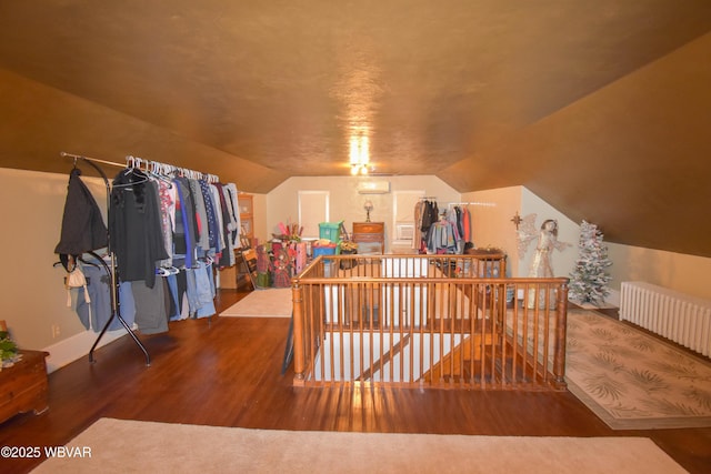 45 W Bald Eagle St, Lock Haven, PA 17745 - bonus room with wood finished floors, vaulted ceiling, baseboards, and radiator