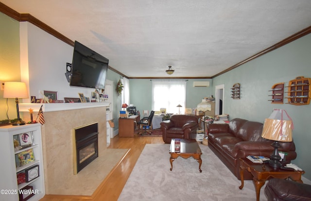 45 W Bald Eagle St, Lock Haven, PA 17745 - living room with crown molding, wood finished floors, a high end fireplace, and a wall mounted air conditioner