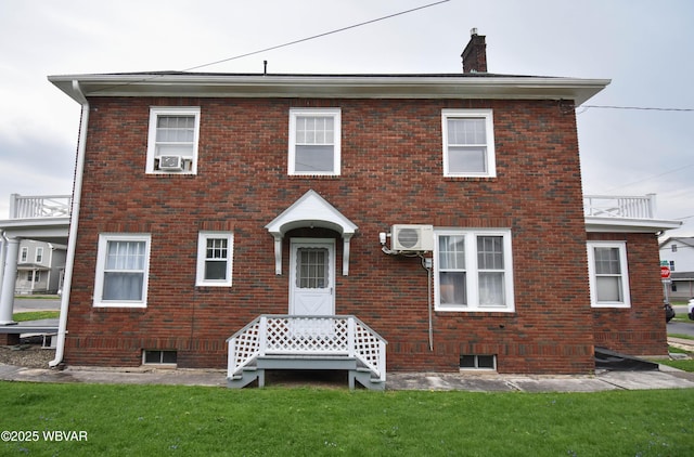 45 W Bald Eagle St, Lock Haven, PA 17745 - view of front of home with brick siding, a chimney, a front lawn, a cooling unit, and cooling unit