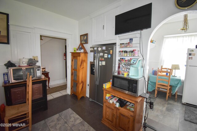 45 W Bald Eagle St, Lock Haven, PA 17745 - kitchen with stainless steel appliances, white cabinets, and arched walkways