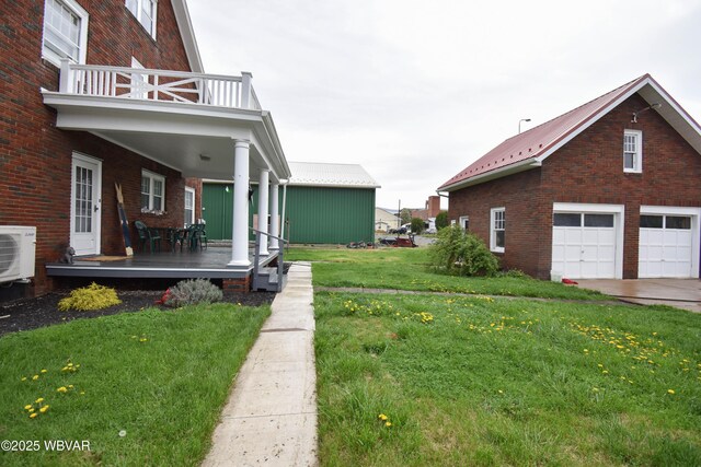 45 W Bald Eagle St, Lock Haven, PA 17745 - view of property exterior with brick siding, a yard, a porch, a balcony, and a cooling unit