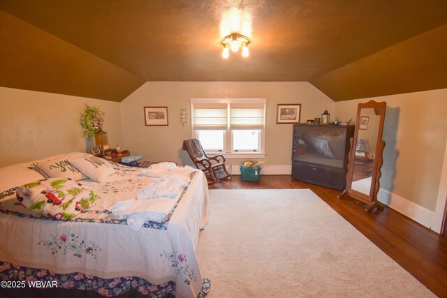 45 W Bald Eagle St, Lock Haven, PA 17745 - bedroom featuring lofted ceiling, wood finished floors, and baseboards