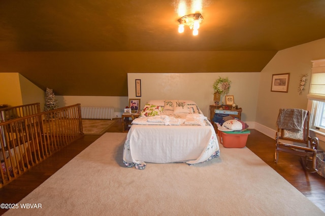 45 W Bald Eagle St, Lock Haven, PA 17745 - bedroom with vaulted ceiling, dark wood-style flooring, radiator heating unit, and baseboards