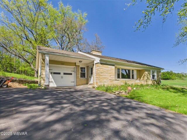 5667 Austinville Rd, Columbia Crossroads, PA 16914 - ranch-style home with a garage, a chimney, asphalt driveway, and stone siding