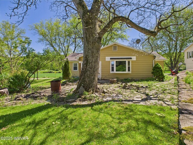 5667 Austinville Rd, Columbia Crossroads, PA 16914 - back of house featuring a yard