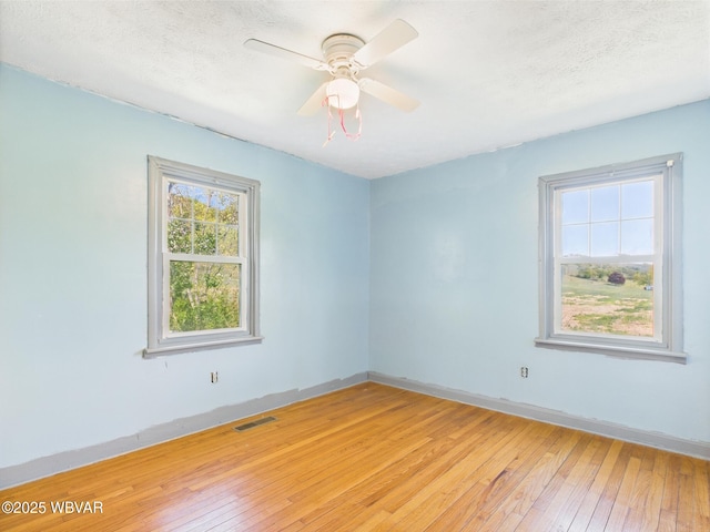 5667 Austinville Rd, Columbia Crossroads, PA 16914 - unfurnished room with light wood-style flooring, baseboards, a ceiling fan, and a textured ceiling