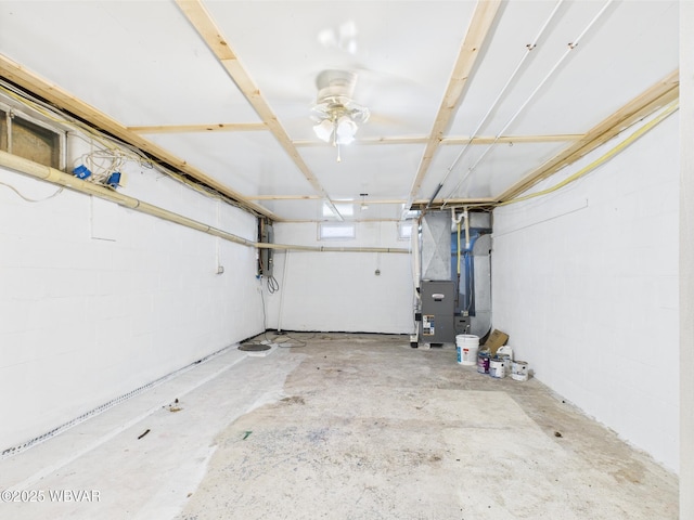 5667 Austinville Rd, Columbia Crossroads, PA 16914 - garage with heating unit, ceiling fan, and concrete block wall