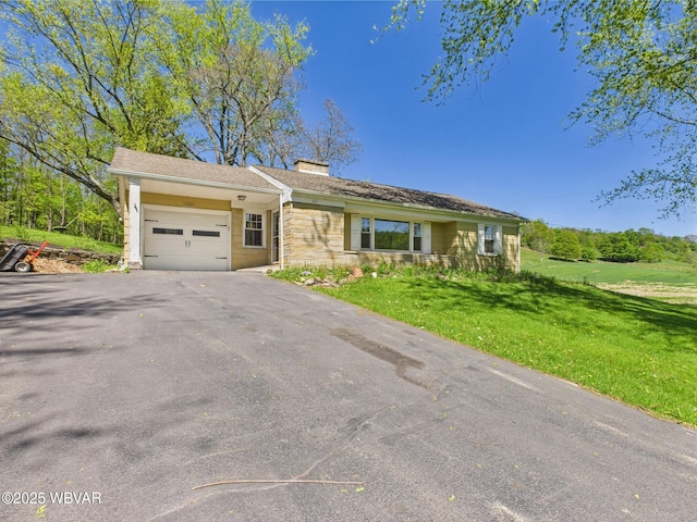 5667 Austinville Rd, Columbia Crossroads, PA 16914 - ranch-style house with an attached garage, a chimney, a front yard, asphalt driveway, and stone siding