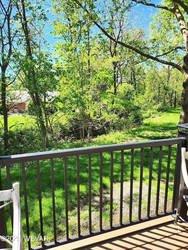 view of wooden balcony with a deck