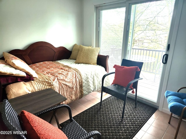bedroom featuring access to outside and tile patterned flooring