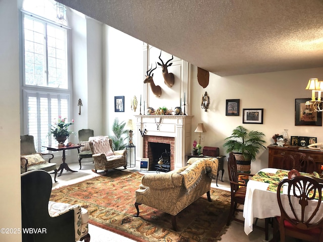 living room featuring a fireplace and a textured ceiling