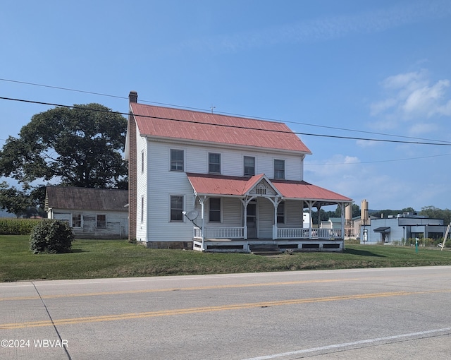 view of front facade featuring a porch and a front lawn