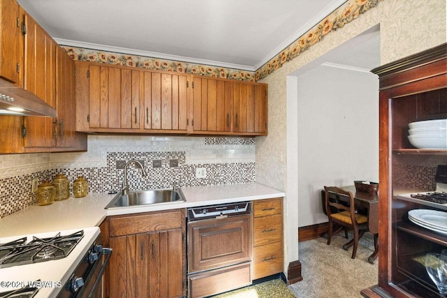 kitchen featuring dishwasher, crown molding, sink, decorative backsplash, and range