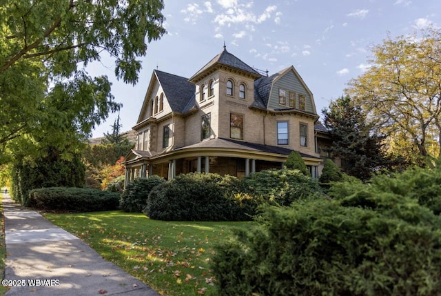 view of home's exterior with a yard