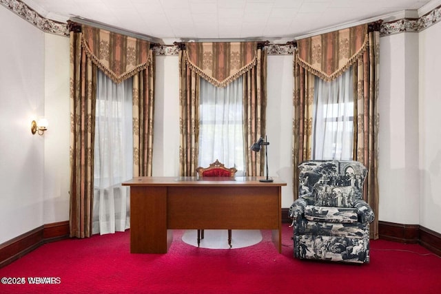 sitting room with carpet flooring, a wealth of natural light, and ornamental molding