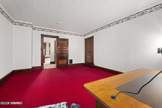 interior space featuring crown molding and carpet floors