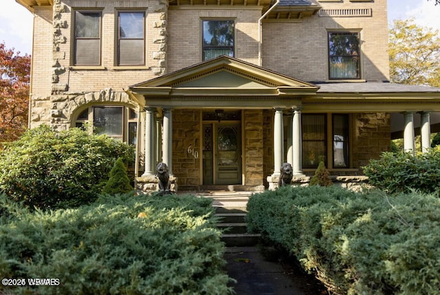 doorway to property with a porch