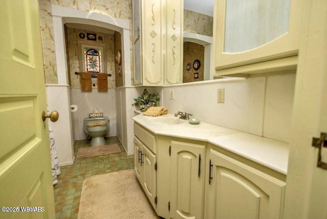 bathroom with vanity and toilet