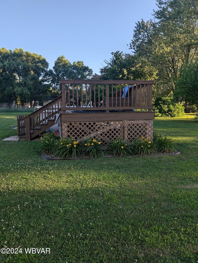 exterior space featuring a yard and a wooden deck