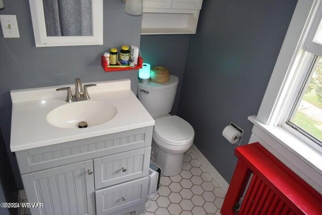 bathroom with vanity and toilet