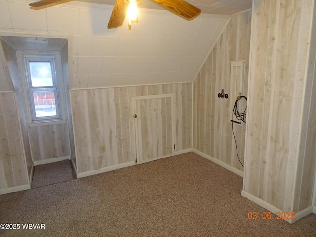 bonus room featuring carpet floors, vaulted ceiling, and ceiling fan