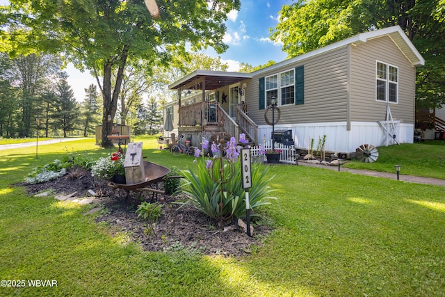 394 Rte 973, Cogan Station, PA 17728 - manufactured / mobile home featuring a front lawn and stairs