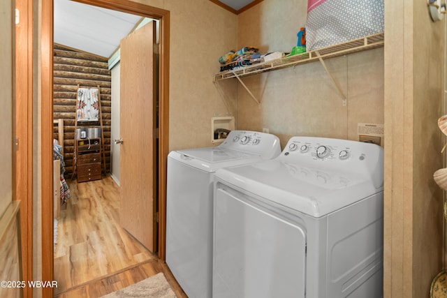 394 Rte 973, Cogan Station, PA 17728 - laundry area featuring rustic walls, washer and dryer, and light wood finished floors
