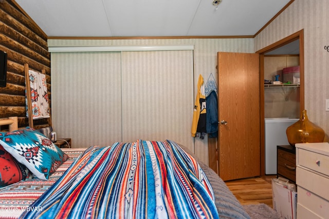 394 Rte 973, Cogan Station, PA 17728 - bedroom featuring wood finished floors, wallpapered walls, rustic walls, crown molding, and lofted ceiling