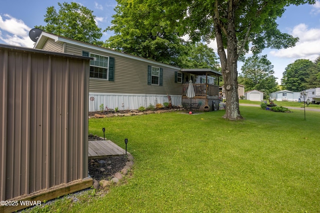 394 Rte 973, Cogan Station, PA 17728 - view of grassy yard featuring a wooden deck