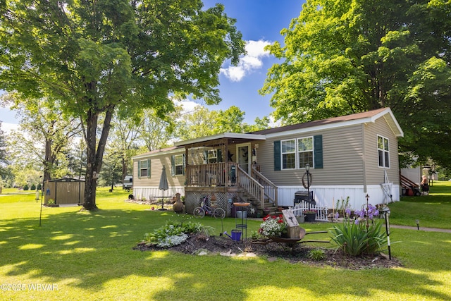394 Rte 973, Cogan Station, PA 17728 - manufactured / mobile home with a front lawn and a porch