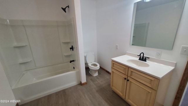 full bathroom with toilet, vanity, shower / bath combination, and hardwood / wood-style flooring