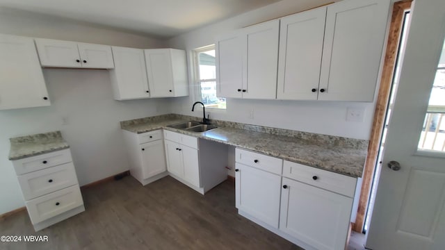 kitchen with white cabinets, dark wood-type flooring, and sink