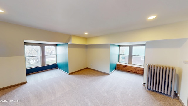665 5th Ave, Williamsport, PA 17701 - spare room featuring radiator heating unit, baseboards, carpet flooring, and recessed lighting