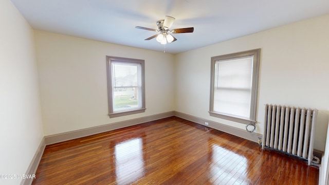 665 5th Ave, Williamsport, PA 17701 - unfurnished room with radiator heating unit, wood-type flooring, baseboards, and ceiling fan