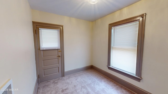 665 5th Ave, Williamsport, PA 17701 - spare room with light colored carpet and baseboards