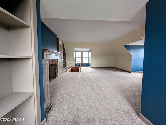 665 5th Ave, Williamsport, PA 17701 - unfurnished living room featuring a fireplace, built in shelves, baseboards, and carpet floors
