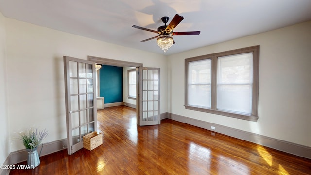 665 5th Ave, Williamsport, PA 17701 - unfurnished room featuring ceiling fan, french doors, wood finished floors, and baseboards