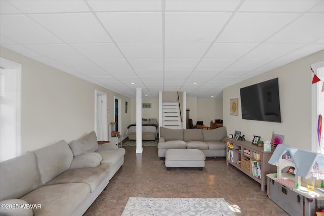 living room with a paneled ceiling