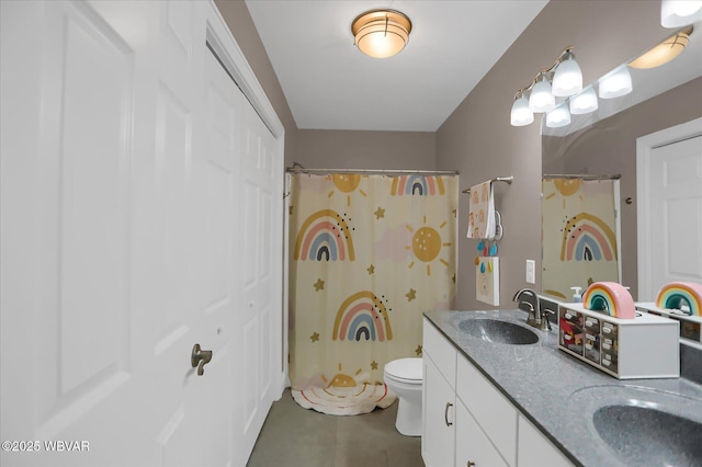 bathroom featuring toilet, vanity, curtained shower, and tile patterned floors