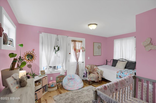 bedroom with light hardwood / wood-style flooring