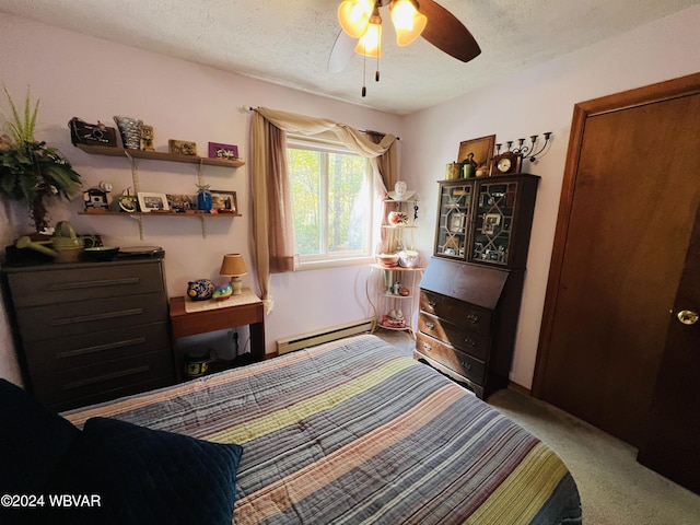 bedroom with a textured ceiling, a baseboard radiator, ceiling fan, and light colored carpet