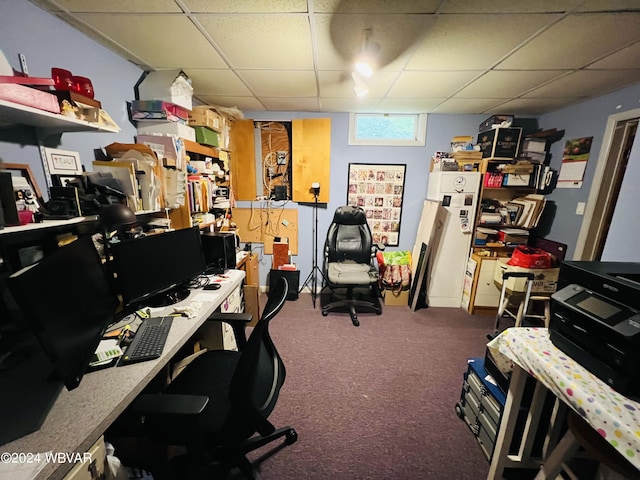 carpeted office space with a drop ceiling