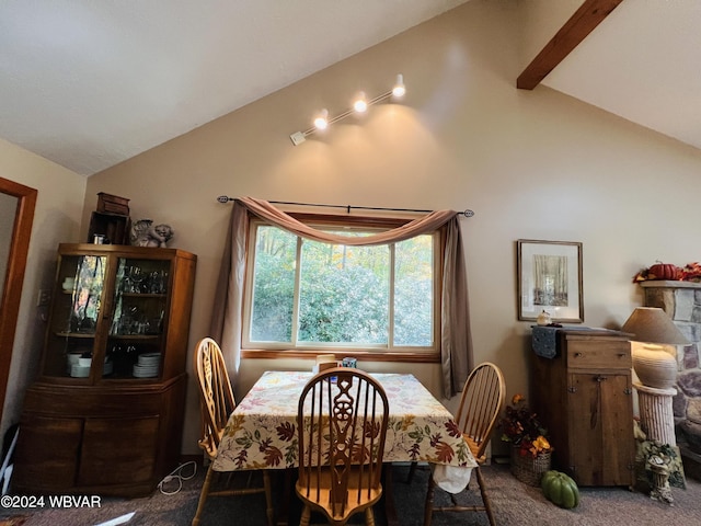 dining room with vaulted ceiling with beams and carpet floors