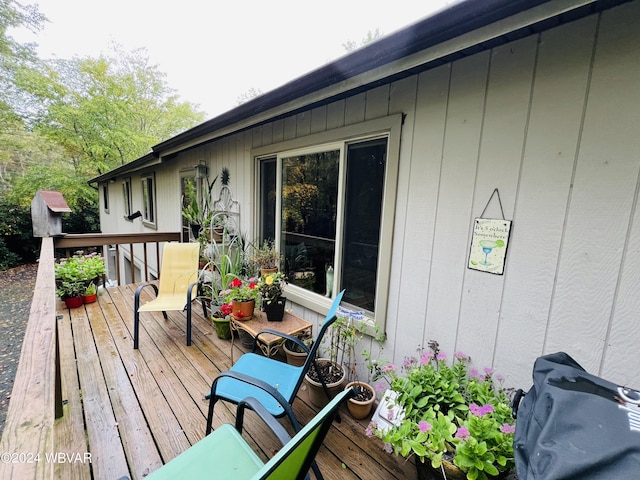 wooden terrace with area for grilling