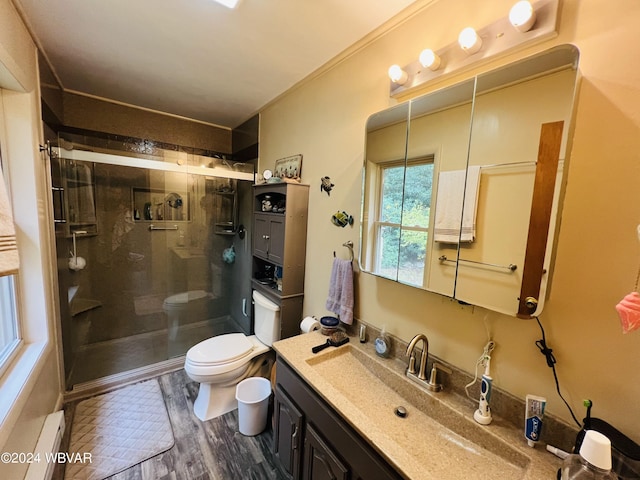 bathroom featuring an enclosed shower, vanity, baseboard heating, hardwood / wood-style floors, and toilet