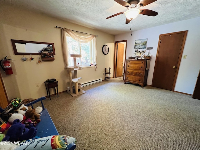 miscellaneous room with carpet flooring, ceiling fan, a textured ceiling, and a baseboard radiator